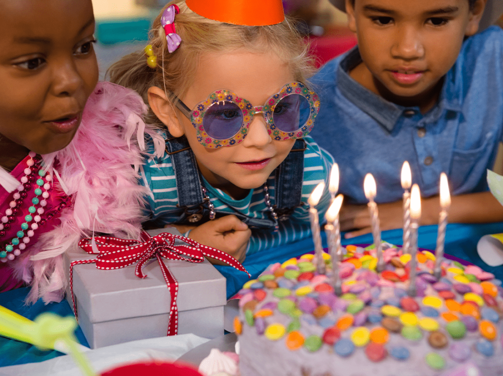 Kids participating in a cultural birthday party experience with authentic activities