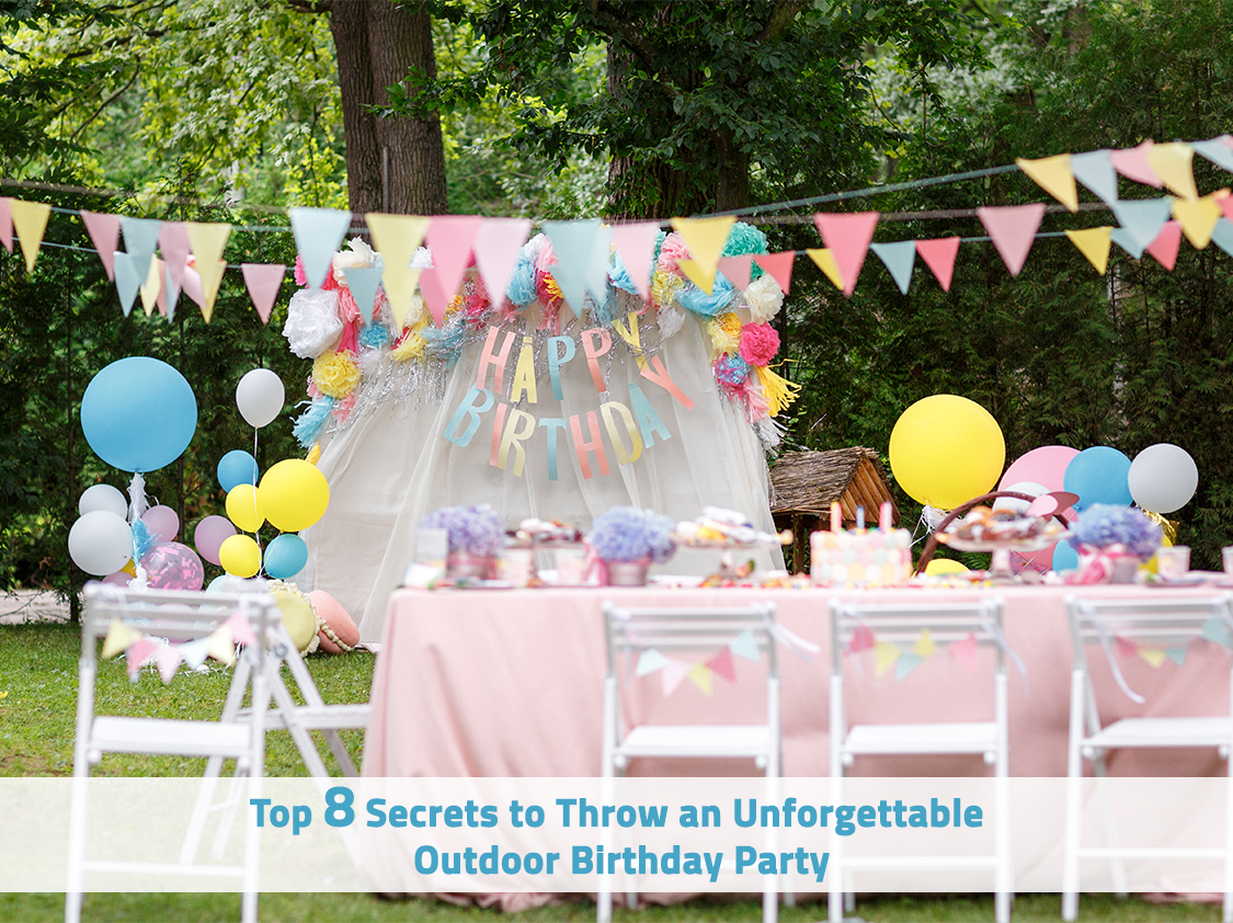 Outdoor birthday party setup with pastel-colored decorations