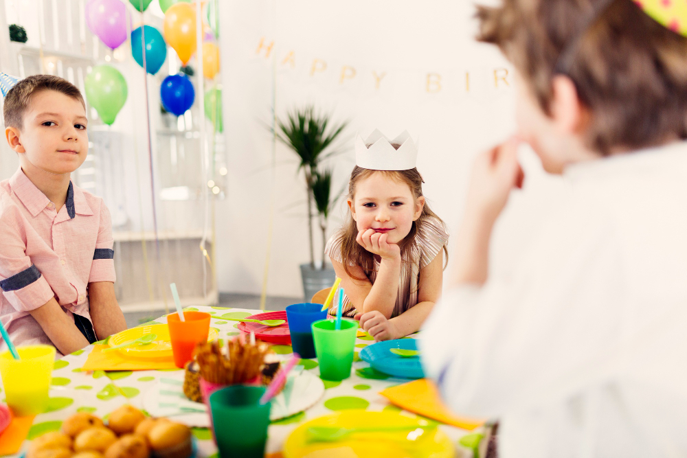 Children happily crafting at an art-themed birthday party in Abu Dhabi, with well-organized stations and clear instructions.