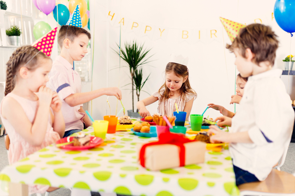 Families enjoying quality time at an art and craft birthday party in Abu Dhabi, working together on creative projects.