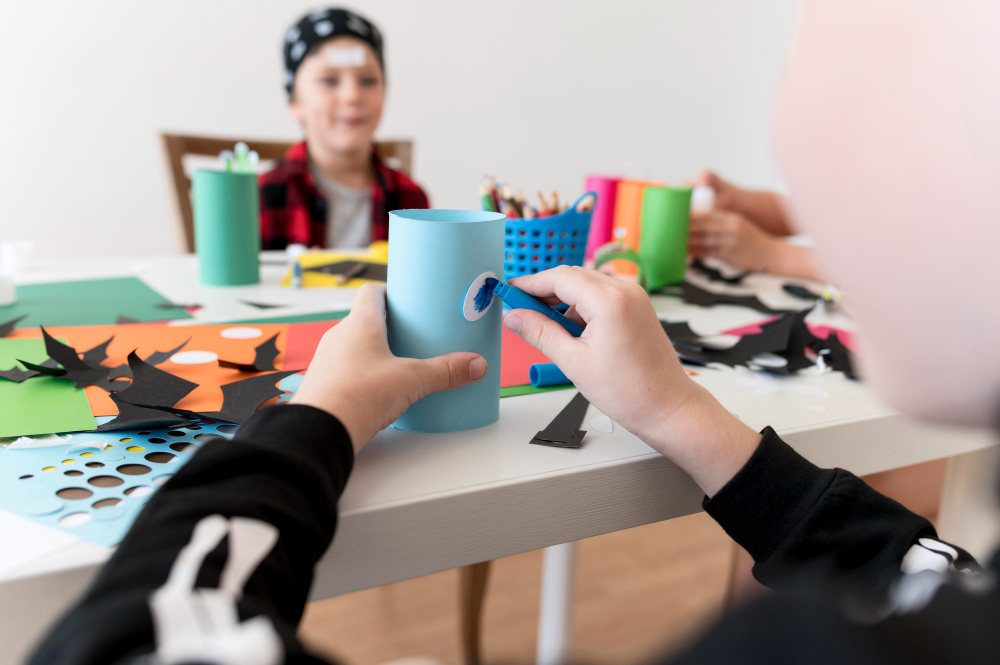 Children engaged in creative art and craft activities during a birthday party in Abu Dhabi.