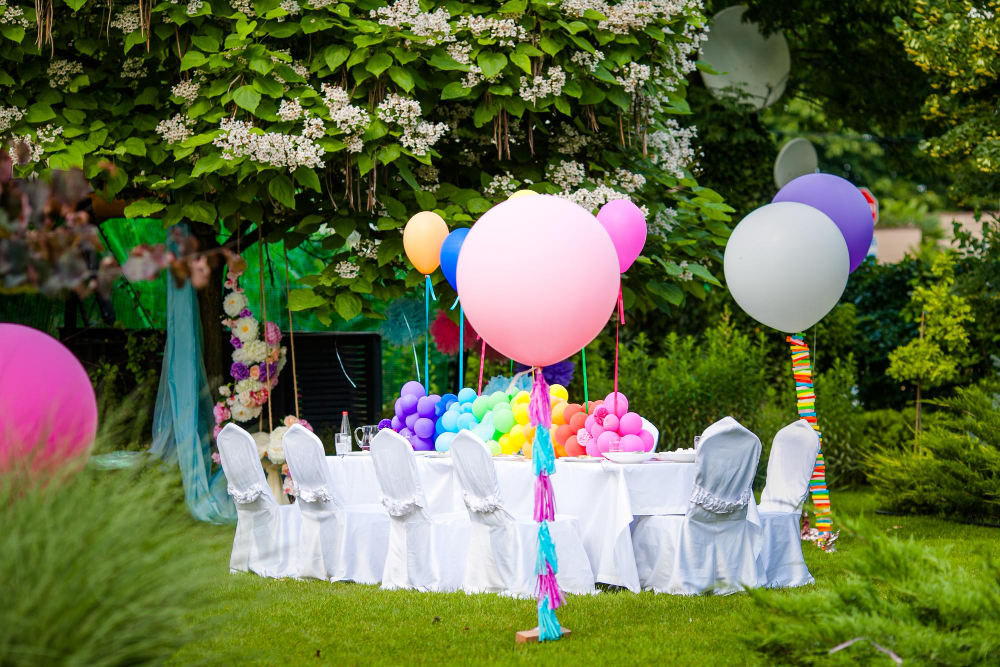 Parents planning an adventure park birthday party in Abu Dhabi, organizing decorations, food, and invitations for a fun-filled day.