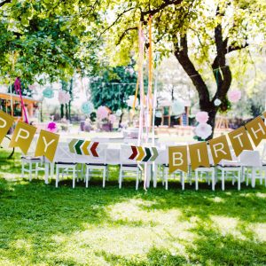 a-table-set-for-kids-birthday-party-outdoors-in-garden-in-summer-1-1.jpg